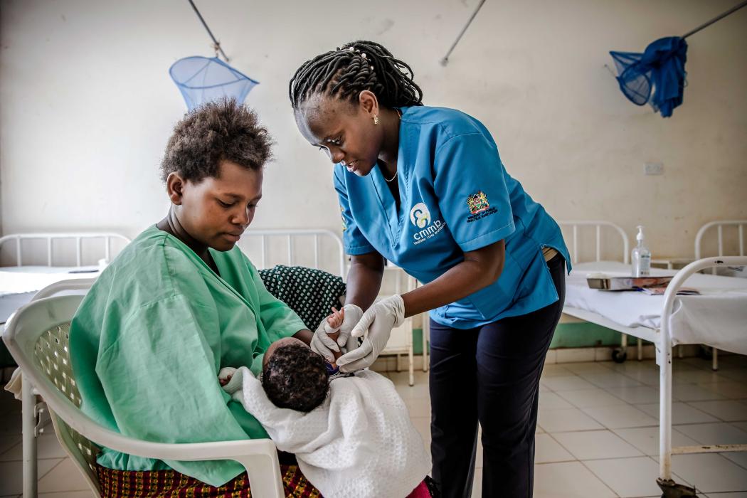A CMMB-supported nurse attends to a new mother and her baby at the Ikanga Sub-County Hospital in Kitui South, Kenya. (Luis Tato/Getty Images for CMMB) 