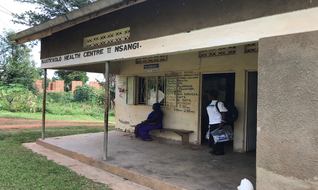 Harriet and a patient outside of Nakitokolo Health Center II, which Harriet advocated for. Photo by Judith Ssesse for Living Goods. 