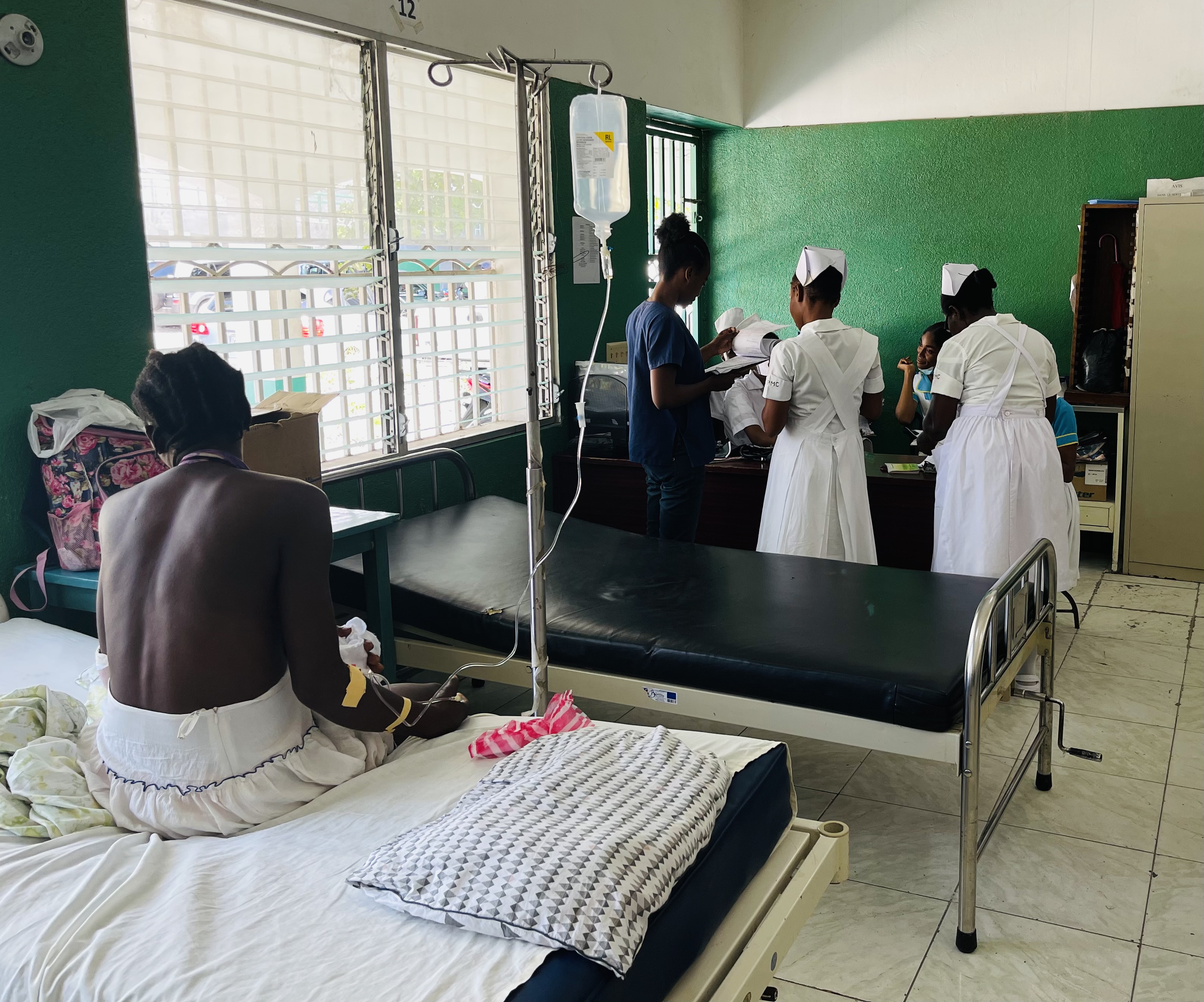 health workers tending to patients at Immaculate Conception Hospital in Les Cayes, Haiti