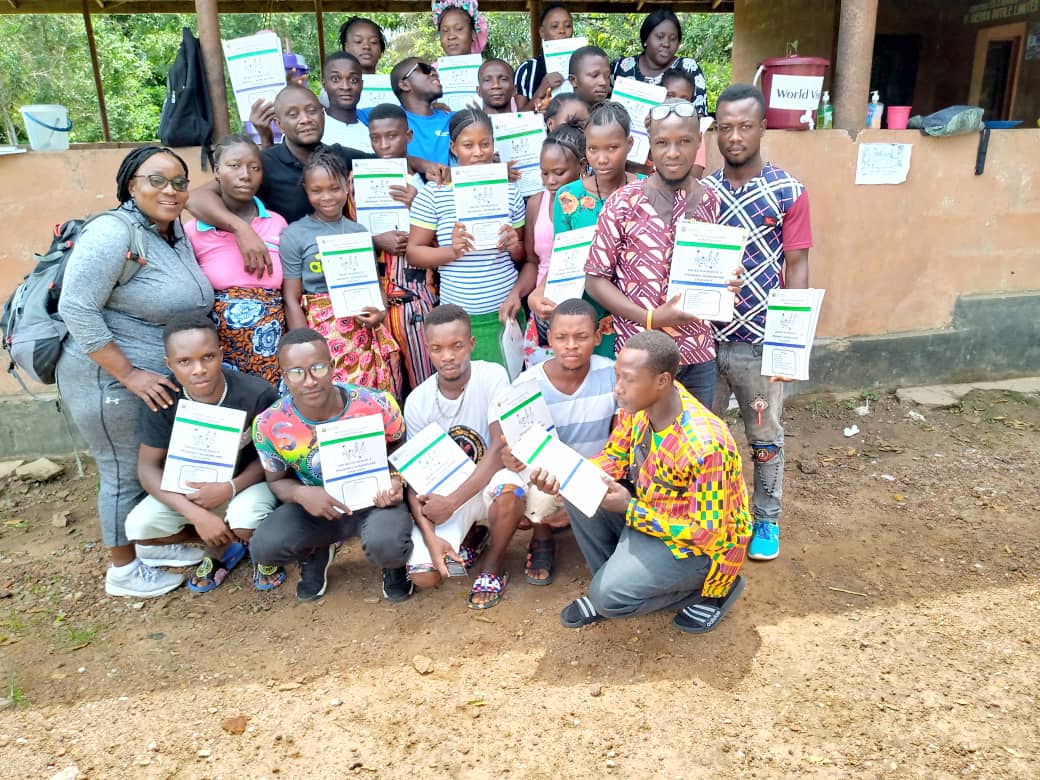 Quality assurance officer Joycelyn Suale with new community health workers at a training site