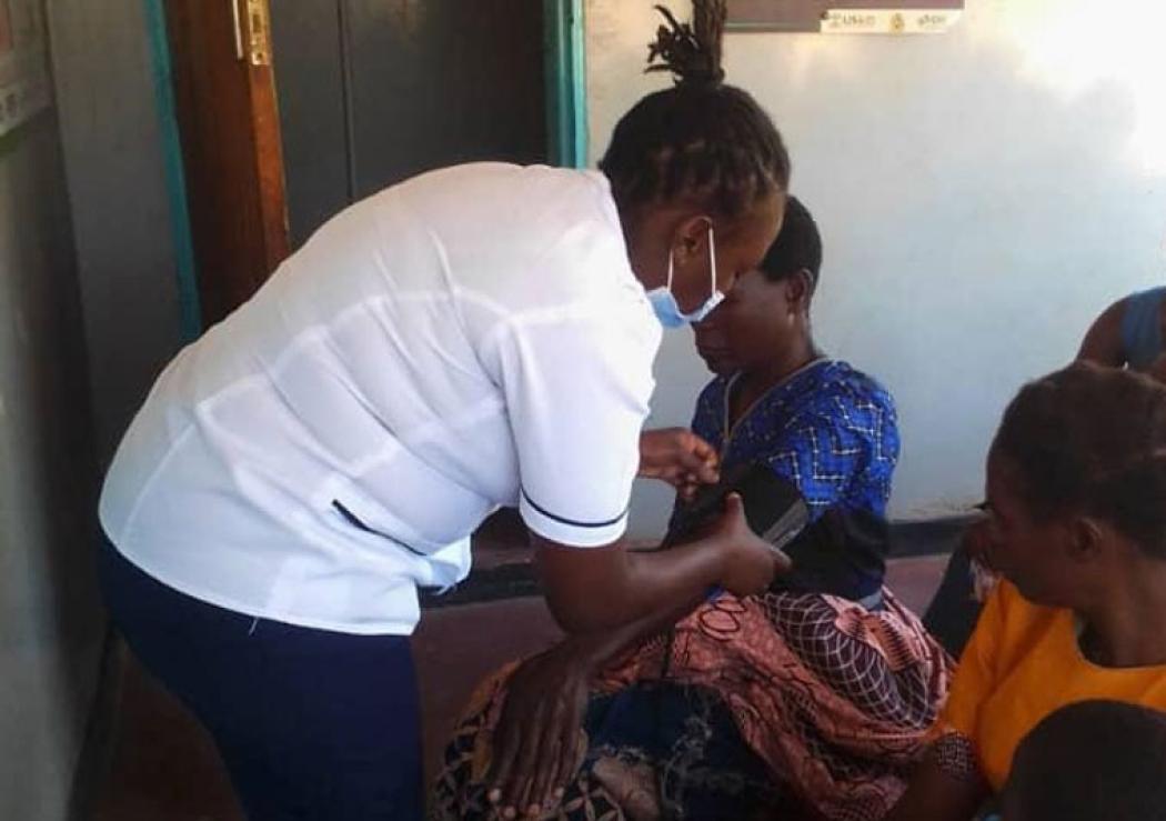 Nurse Chikondi Ndalama, a nurse fellow in Malawi supported by GAIA Global Health and USAID, attends to patients. Photo courtesy of GAIA Global Health.