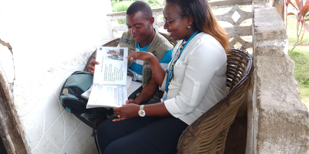 A Community Health Worker and a Financing Alliance for Health team member on a field visit in Liberia.