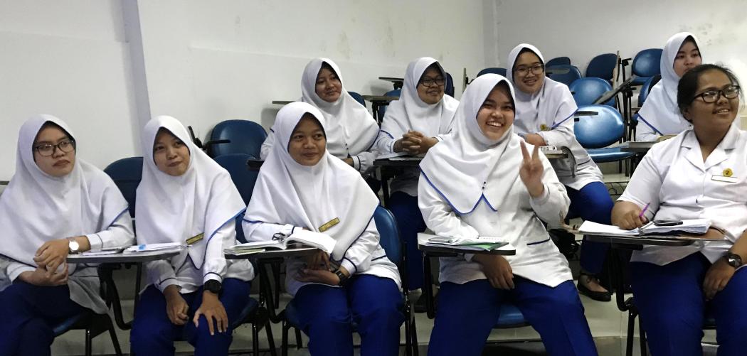 Midwifery students in class at the Budi Kemuliaan private maternity hospital and midwifery school in Jakarta, Indonesia. Photo by Rachel Deussom for HRH2030/Chemonics International.