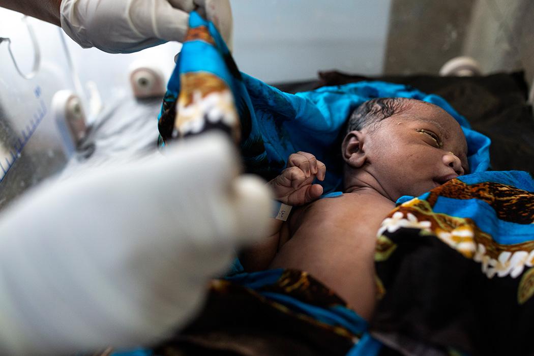 A nurse takes care of a newborn baby at Lodwar Referral Hospital in Turkana, Kenya. Photo by Patrick Meinhardt for IntraHealth International.