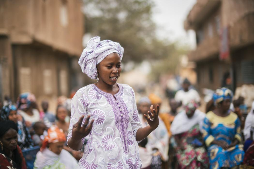 A member of the women&#039;s advocacy group Nieta in western Mali speaks out against early marriage, female genital mutilation, and obstetric fistula, and about the need for family planning in her country. Photo by Nana Kofi Acquah for IntraHealth International.

