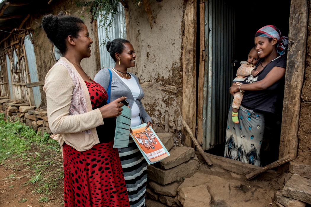 Above: Health Extension Worker Misaye Asmamaw (center) visits Addise Yaregale and her son, Saleamelak, (right) at home. (Photos courtesy of Karen Kasmauski/MCSP)
