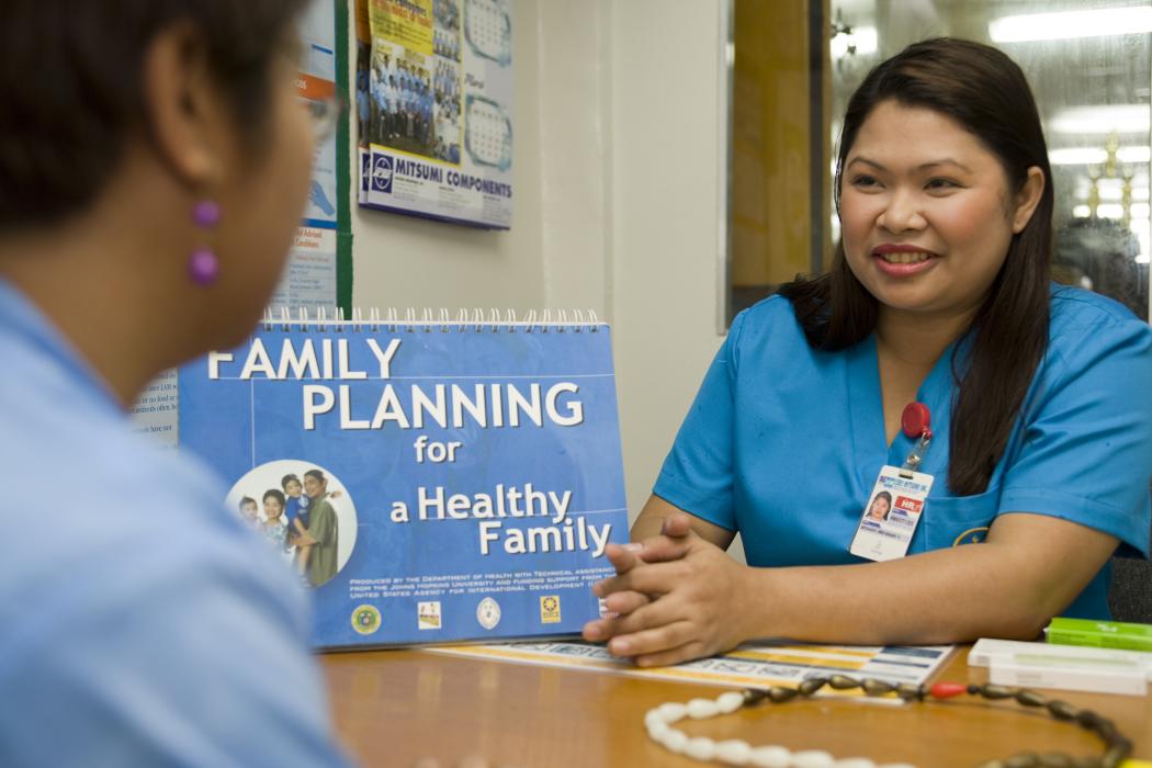 A health worker counsels a client about family planning methods in the Philippines. Photo credit: Chemonics