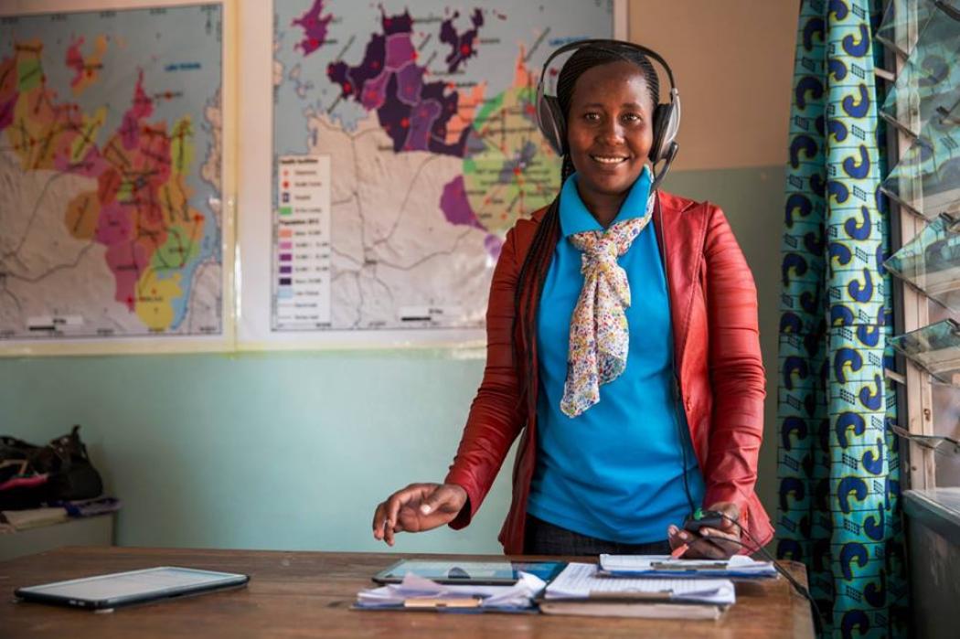 Working as a dispatcher in Touch’s Mobilizing Maternal Health program, Restituta helps women in labor reach emergency care. Photo courtesy of Touch Foundation