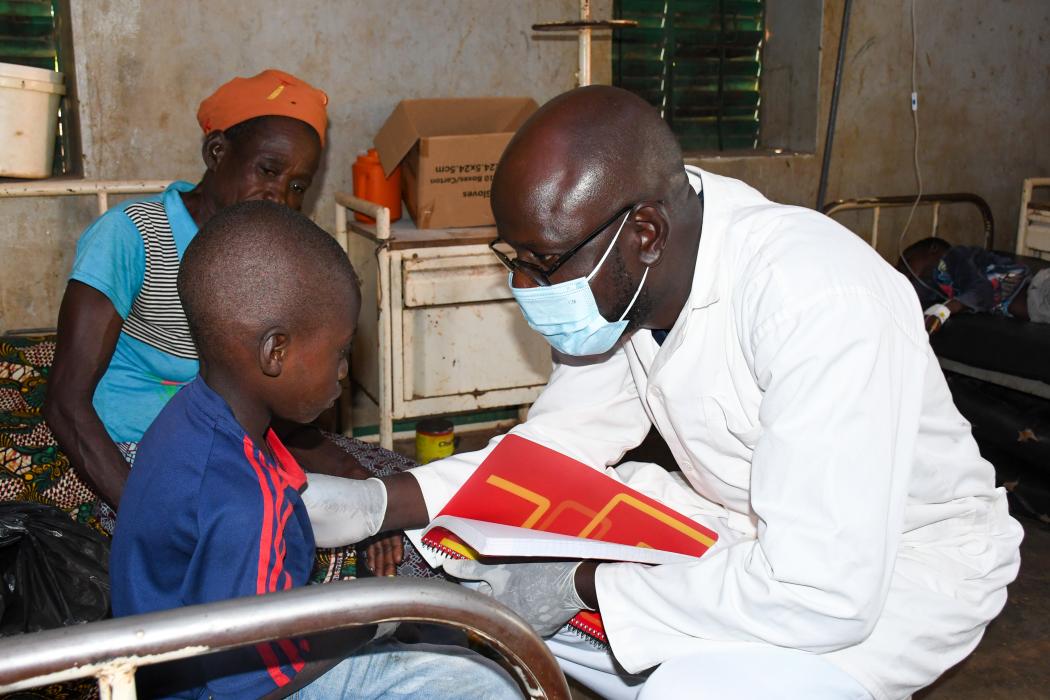 Roger Zingue (right) is the nurse in charge of the Primary Health Care Center at the Bolember health facility in rural Burkina Faso. Photo by Souleymane Zare for Jhpiego.