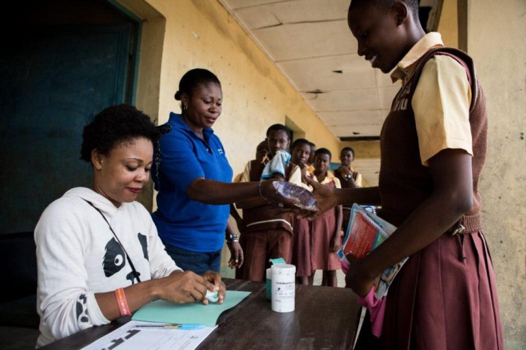 Health volunteers distribute NTD medicines to students in Calabar, Nigeria. Photo Credit: RTI International/Ruth McDowall