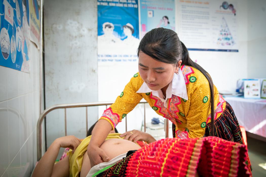 A midwife in Vietnam conducts a prenatal exam. UNICEF, the Government of Vietnam, and Johnson &amp; Johnson are partnering on a national program for early essential newborn care by empowering more than 500 ethnic minority midwives in remote locations to bring improved care to village homes and clinics. Photo courtesy of Johnson &amp; Johnson.