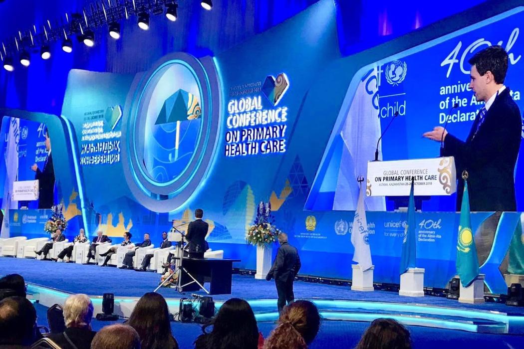 Frontline Health Workers Coalition Director Vince Blaser asks a question of panelists at the ministerial session on health workforce at the Global Conference on Primary Health Care in Astana, Kazakhstan. Photo courtesy IntraHealth International.