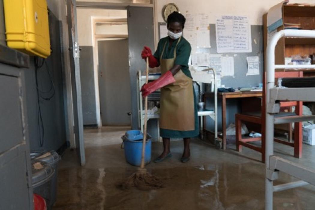 Gloria Mkukawa cleans the maternity ward at Ntosa Health Center. Courtesy WaterAid/Dennis Lupenga.