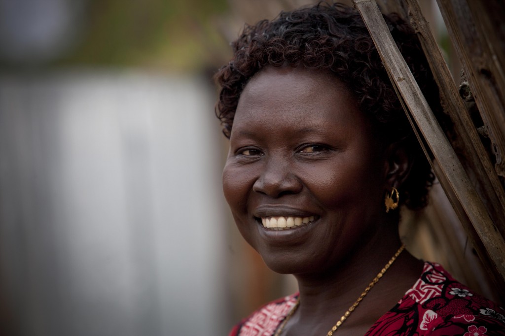 Mary Rose Dalaka  a midwife who works for the Mundri East Development Association, poses for a phtoograph at her home near  Lanyi, in Mundri East County South Sudan on the 25th July, 2013. Courtesy Jhpiego/ Kate Holt