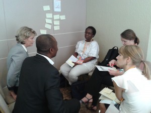 A small group discussion during the session at the Third Global Forum on Human Resources for Health discussing the Improvement Framework for Health Worker In-service Training. Courtesy URC.
