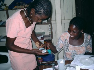 A Hesperian partner and community health worker monitors a patient for diabetes in Colombia. Credit Hesperian