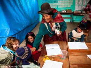 A qhali teaches schoolchildren about vitamins Photo credit: Vitamin Angels 