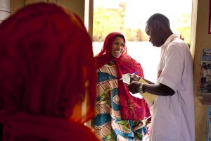 A pharmacist delivers drugs at a clinic in Mali. Photo by Trevor Snapp, IntraHealth International