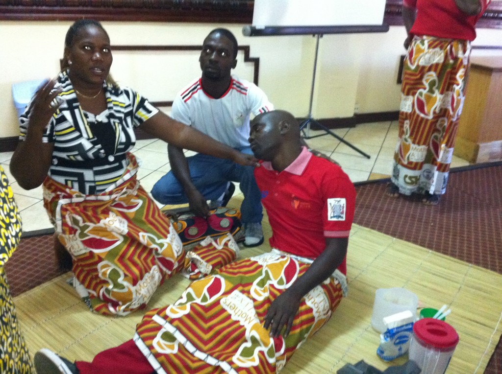 Zambian health workers role play during home-based lifesaving skills training delivered by ACNM Department of Global outreach midwives as part of the ongoing ZISSP project/ Courtesy American College of Nurse-Midwives