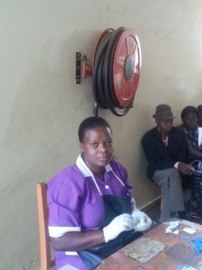 Nurses, including HIV counseling and testing nursing assistant Priscilla Kezaabu (center), provide HIV testing services at Fort Portal Regional Referral Hospital in western Uganda. Courtesy URC/USAID SUSTAIN.