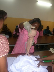 A matrone learns proper techniques during active management of third stage of labor training. Courtesy Abt Associates